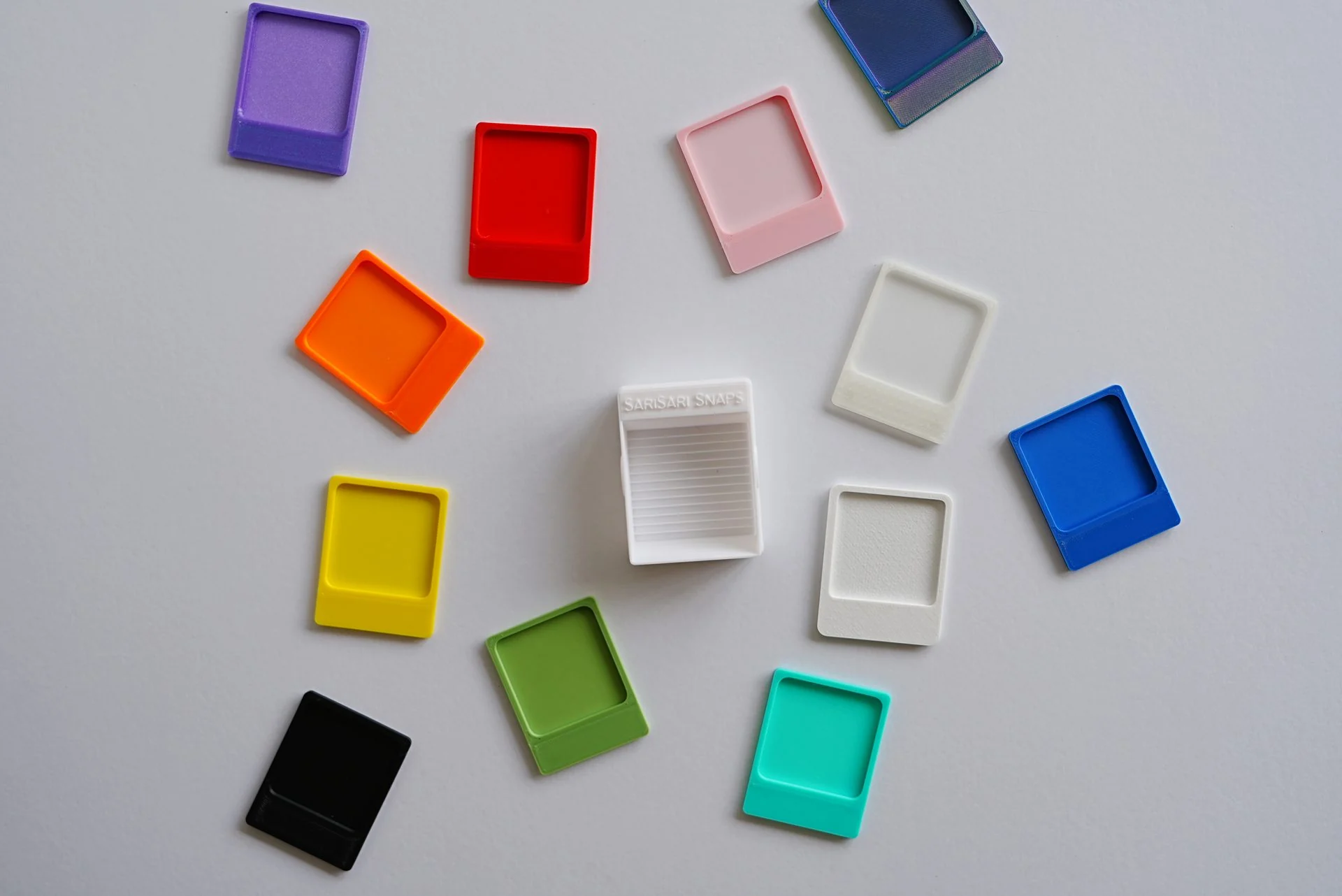 A wide range of early SariSari Snaps prototypes in bright colours and different finishes