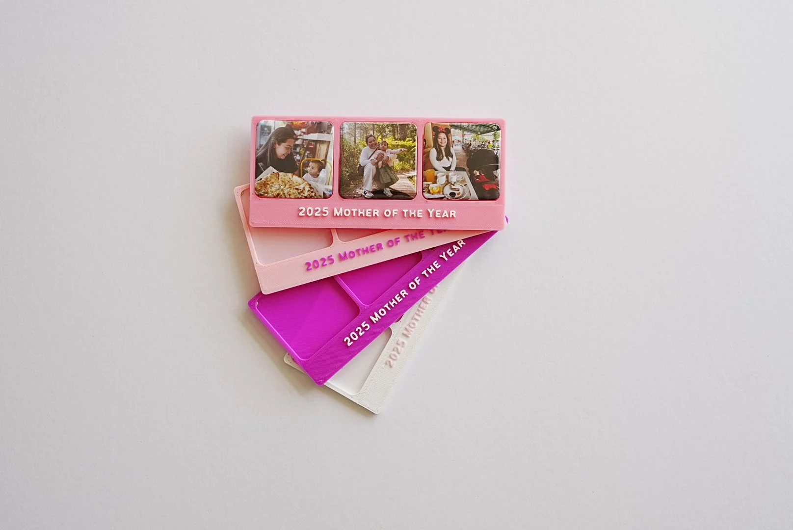 Several personalised SariSari Snaps frames with text placed in the lower skirt